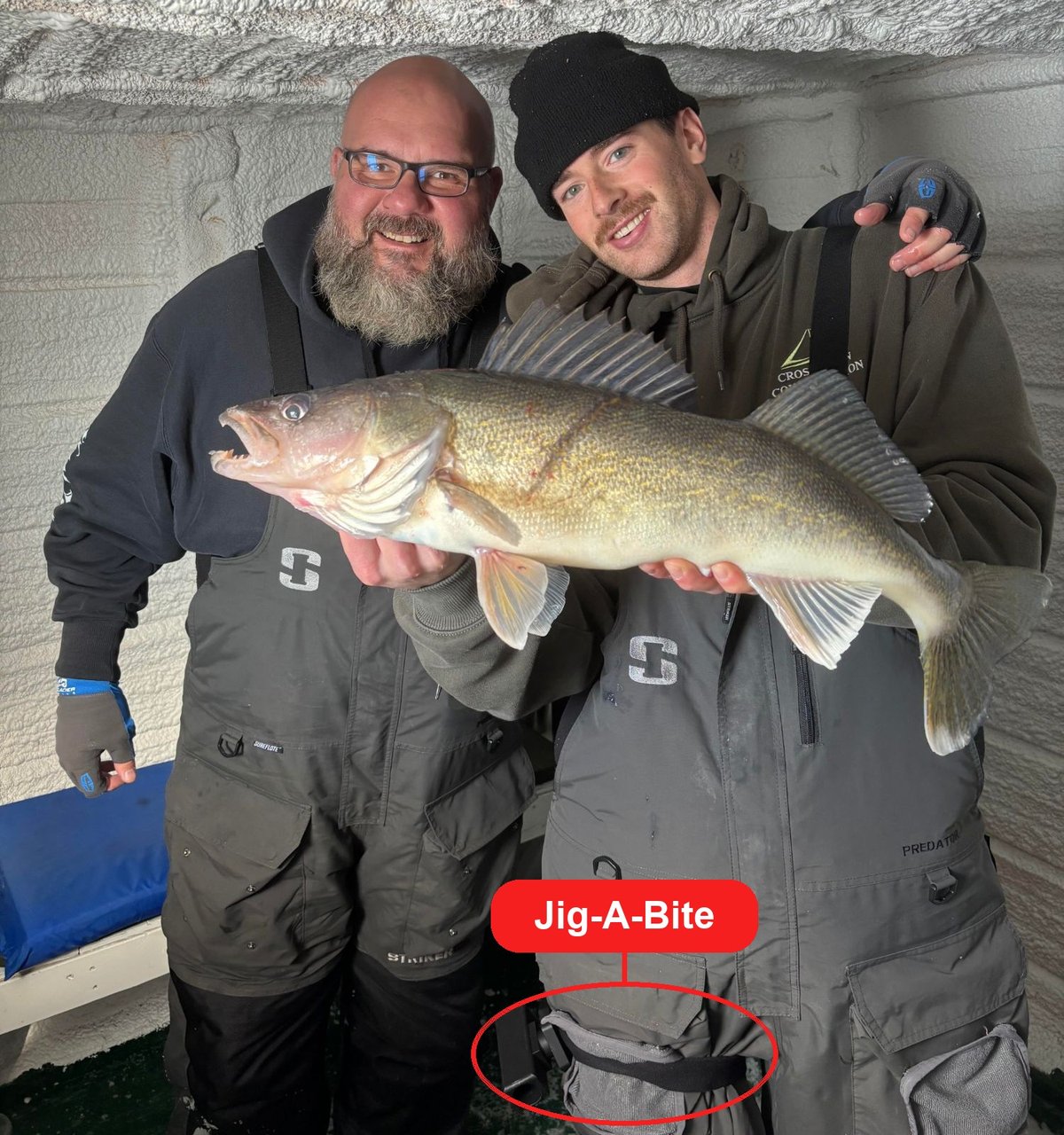 Richie H. holding a big walleye on the ice, with the Jig-A-Bite strapped to his leg